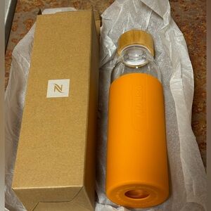 NEW Nespresso Reusable Glass Water Bottle w/ Orange Silicone Sleeve 500 ml/16 oz